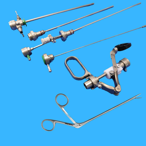 Assorted stainless steel surgical dental instruments by GN SURGICAL LTD on blue background